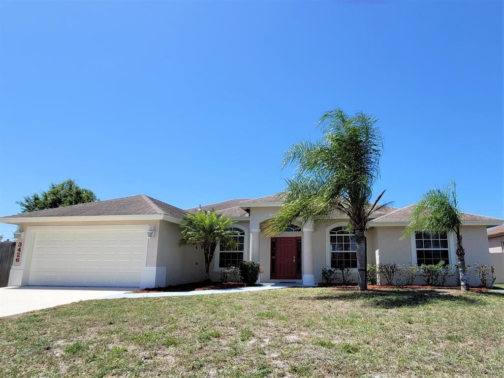 Photo of 3426 SW Darwin Boulevard, Port Saint Lucie, FL 34953 (MLS # R10787317)
