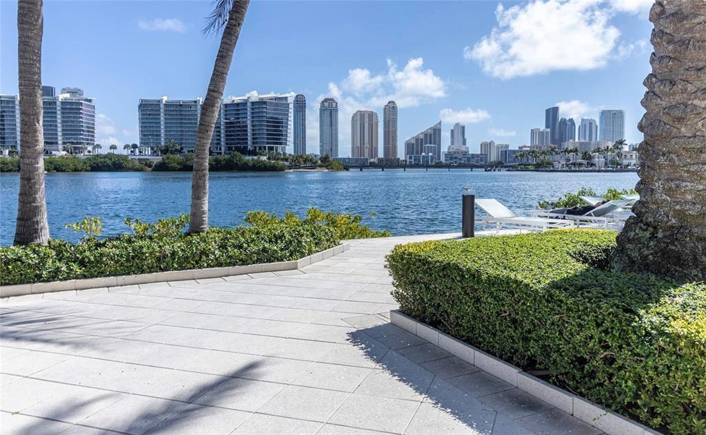 Excellent investment opportunity in the heart of Aventura! This spacious 2BD/2BA third-floor condo in gated Village by the Bay is easy to rent—minimum 31 days, 12 times per year. Features include an open kitchen, spacious layout, great storage, full-size washer/dryer, and one assigned covered parking space. Enjoy resort-style amenities: 2 pools with sundecks, fitness center, tennis courts, theater, clubhouse, party room, business center, BBQ area, guest parking, walking paths, and a dog park. Gated with 24-hour security. Prime location near shopping, A+ schools, dining, entertainment, and beaches. Well-maintained building in a highly desirable community.