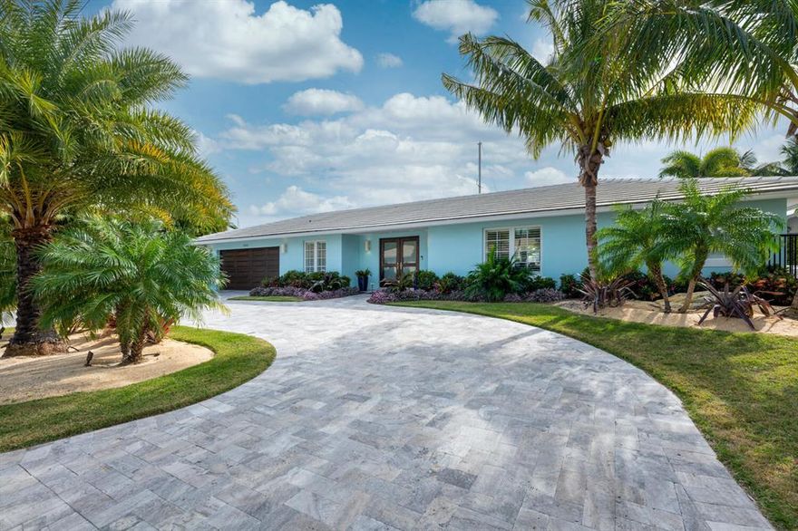 Maximum boating experience and tropical elegance awaits you! This stunningly custom renovated property is move in ready and will exceed your expectations. The home is just four away from the Intracoastal and has 100 ft of deep water dockage Every detail from the high ceilings, white oak floors, custom large chef kitchen with Wolf appliances, oversized waterfall quartz island, outdoor loggia, air conditioned garage, and open layout will draw you in. Impact windows and French doors throughout. Come visit this showcase property as it will not last long.