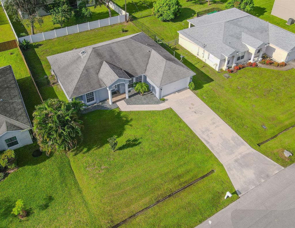 Photo of 564 SW Backert Avenue, Port Saint Lucie, FL 34953 (MLS # R11012552)