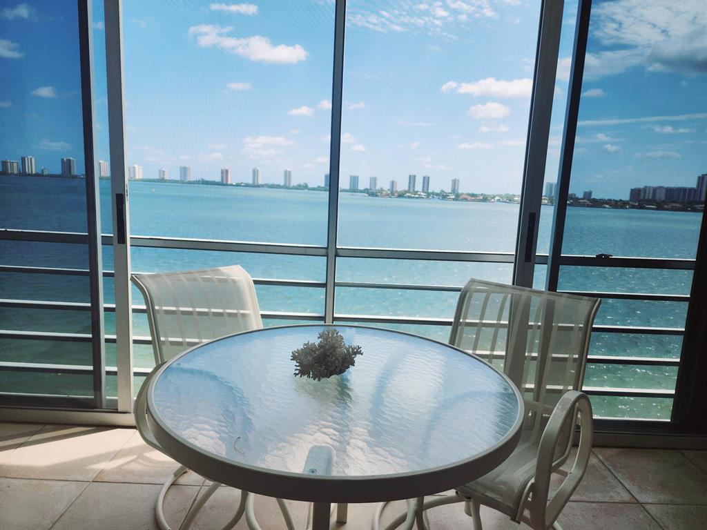Waterfront living at it's best! Wide intercoastal views with extended covered balcony that stretches the length of this magnificent 2 bed/2 bath condo. Enjoy sunsets as you watch the yachts go by. Accordion shutters. Gated, & 1 covered parking space.