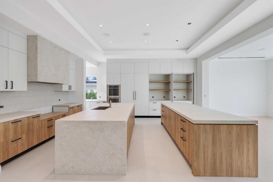 Redefined at every level, this reimagined 2025 custom waterfront estate in Boca Harbour exquisitely marries Key West charm with the sophistication of contemporary coastal living. Designed by PX Architecture and brought to life by Barron Development, the residence was meticulously rebuilt from the studs up with unwavering attention to detail and superior craftsmanship. Every system has been thoughtfully upgraded and replaced--from plumbing and electrical to roofing, foam insulation, and impact-rated doors and windows--ensuring a modern, state-of-the-art foundation for enduring elegance.