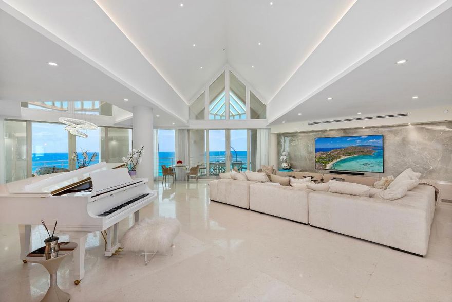 Presidential Penthouse with Ocean and Lake Boca Views
Located in the exclusive Presidential Place, this fully renovated southeast corner penthouse offers unobstructed views of the Atlantic Ocean and Lake Boca from every room. With over 5,400 square feet, this 4-bedroom, 4.5-bath residence combines volume, privacy, and detail at every level.
A private elevator opens directly into the home, where vaulted ceilings and floor-to-ceiling impact glass frame the sweeping views. The kitchen faces the ocean and features premium appliances, custom cabinetry, and luxury finishes throughout. Multiple balconies wrap the residence, connecting the interior to the surrounding water and sky. The primary suite features dual bathrooms, dual closets, and access to both south and east-facing terraces. Every bedroom is en suite and finished with designer details.
Presidential Place is a boutique, full-service building on the grounds of The Boca Raton Resort and Beach Club, offering valet, concierge, private beach cabanas, and two assigned garage parking spaces. Membership to the Boca Raton Club is available, creating access to world-class amenities just steps from your front door.

The information published and provided including but not limited to prices, measurements, square footages, lot sizes, features, finishes, and calculations are subject to errors, omissions or changes without notice. All such information should be independently verified. All parties should perform their own due diligence to verify all information.