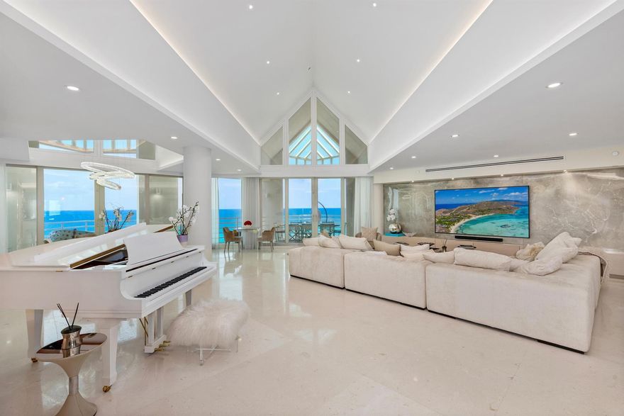 Presidential Penthouse with Ocean and Lake Boca ViewsLocated in the exclusive Presidential Place, this fully renovated southeast corner penthouse offers unobstructed views of the Atlantic Ocean and Lake Boca from every room. With over 5,400 square feet, this 4-bedroom, 4.5-bath residence combines volume, privacy, and detail at every level.A private elevator opens directly into the home, where vaulted ceilings and floor-to-ceiling impact glass frame the sweeping views. The kitchen faces the ocean and features premium appliances, custom cabinetry, and luxury finishes throughout. Multiple balconies wrap the residence, connecting the interior to the surrounding water and sky.