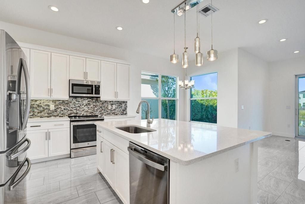 Photo of 9623 Brook Isles Avenue, Delray Beach, FL 33446 (MLS # F10537231)