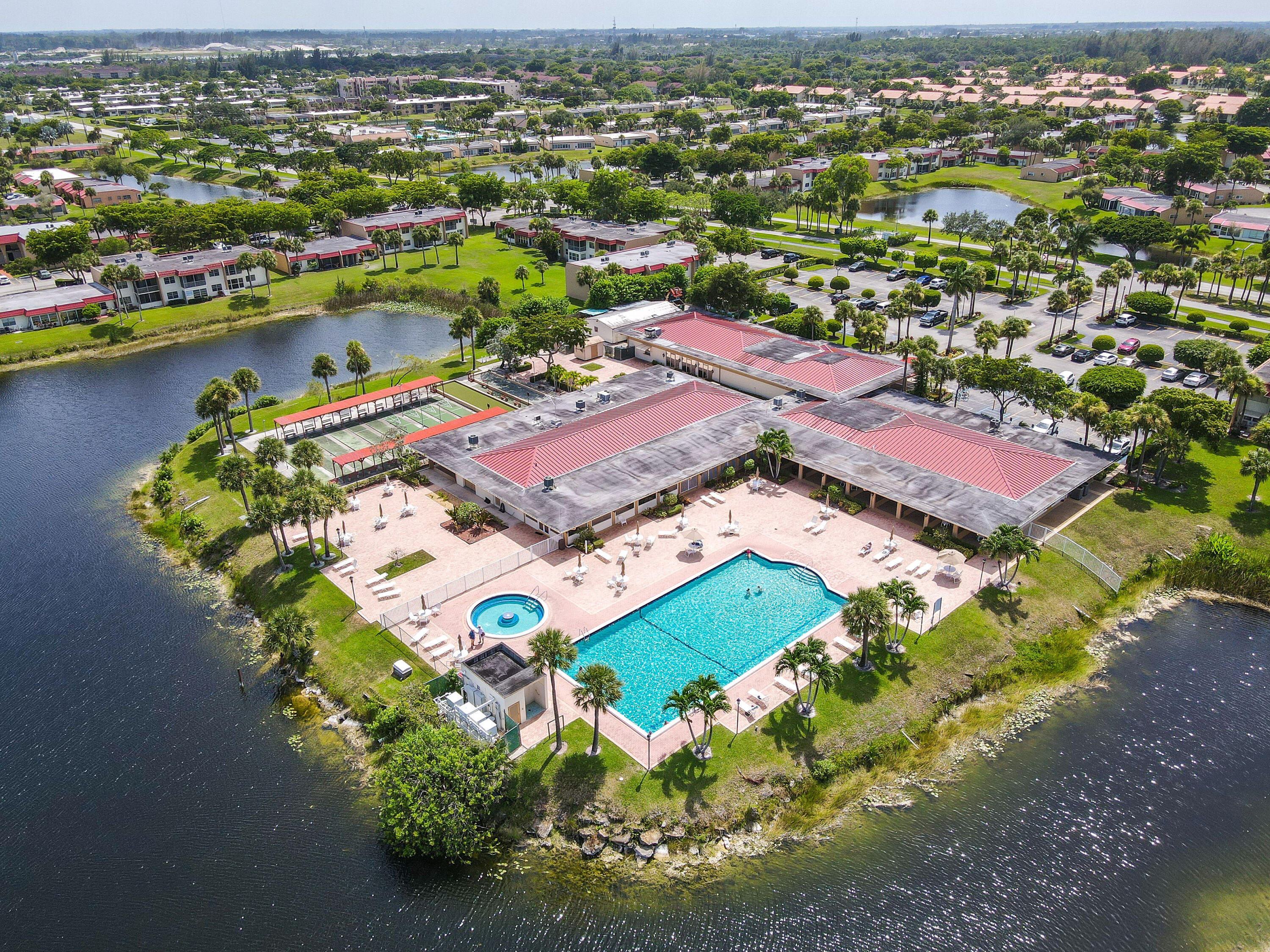 Enjoy Florida Living in this Charming 55+ Lakefront Condo! No stairs, just easy ground-floor living with a calming lake view right from your enclosed patio! This beautifully updated 2-bed, 2-bath condo features new tile flooring throughout and an upgraded kitchen with sleek quartz countertops. Bathroom have been remodeled to offer modern style, and you'll love the convenience of a stackable swasher/dryer in-unit.The spacious bedrooms include a walk-in closet for plenty of storage. Plus, with an additional occupant minimum age of 18 and pet-friendly policies, this home is perfect for a variety of lifestyles. HOA fees cover everything you need, including water, cable, exterior maintenance, building insurance, and access to the gated community's...