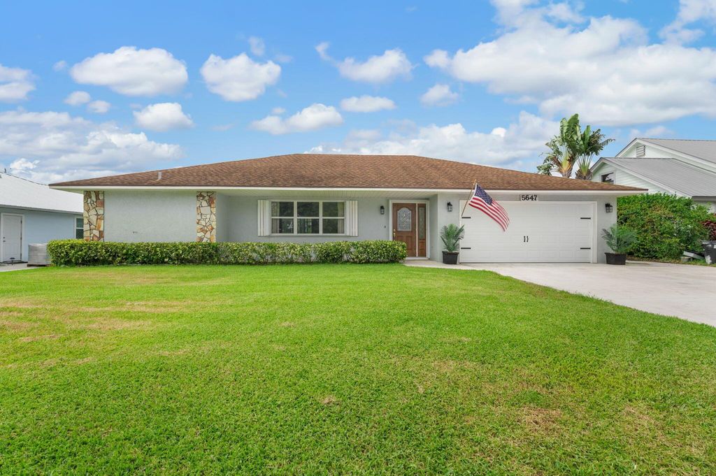 Photo of 5647 SE Sailfish Way, Stuart, FL 34997 (MLS # R11102995)