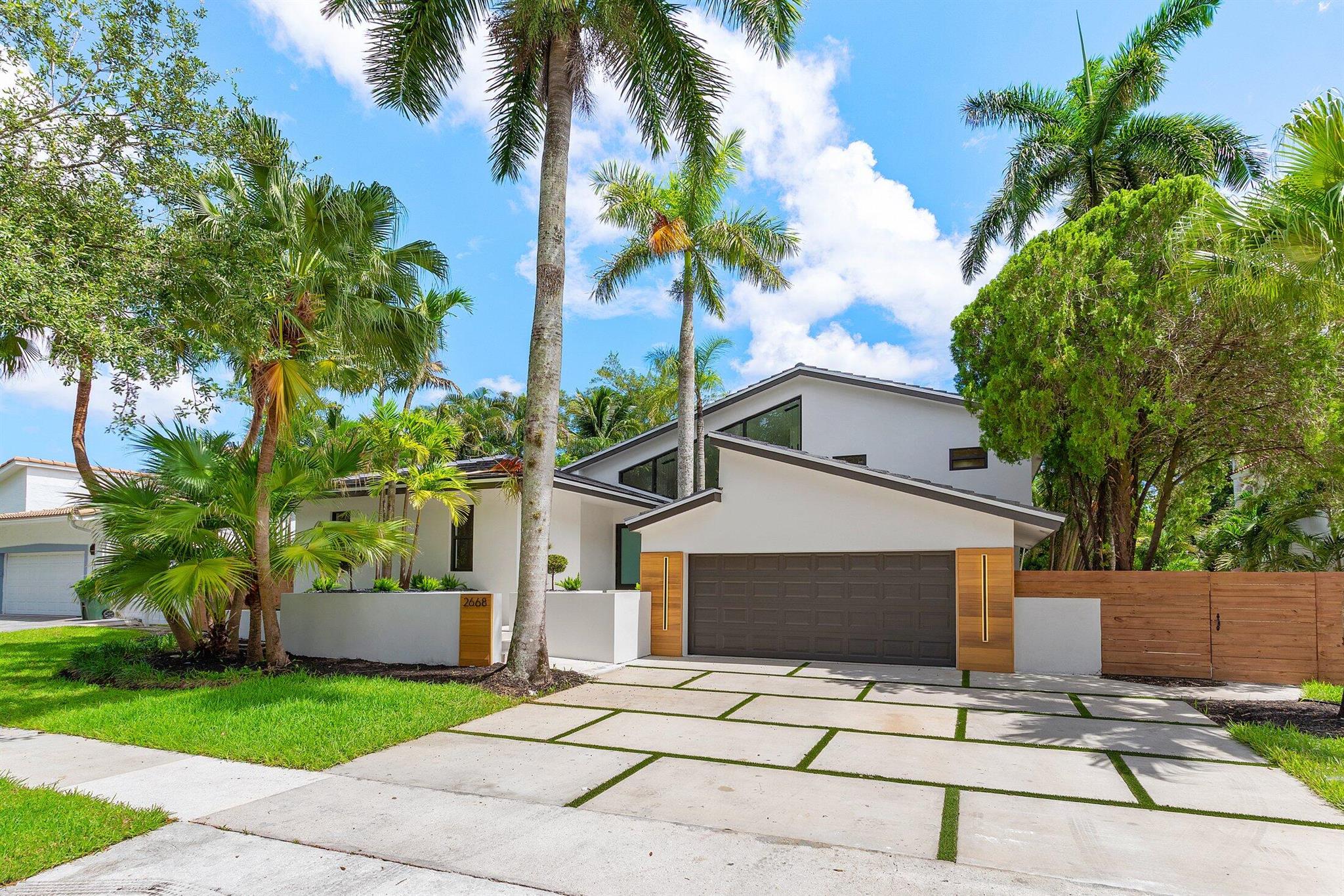 Architectural Elegance Meets Modern PrestigeThis striking residence commands attention with soaring 18-foot-wide front windows, flooding the interior with natural light and crafting a showstopping facade. Designed for those who value timeless architecture and refined living, the home is tucked within a serene, tree-lined neighborhood known for its exclusivity and mature landscaping. Zoned to top-rated A+ schools, it's the perfect haven for discerning families seeking luxury without compromise. A rare opportunity where form, function, and location unite.