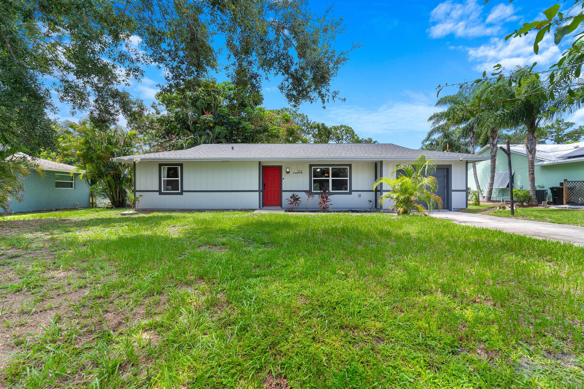 Welcome home to this immaculate 2 bedroom 2 bath opportunity located in the heart of Port St. Lucie with NO HOA! As soon as you enter, you notice the abundant natural light and view to the huge backyard. The home features a stacked bedroom floor plan and tile flooring throughout for added convenience. The kitchen boasts modern blue cabinetry with stainless steel appliances opening out to the dining area, perfect for entertaining. The primary bedroom provides tons of space, ample closet storage, comfortable en suite bath and french doors leading out to the backyard. The home also provides a large finished sunroom that offers a bonus space for office, playroom or den. Out back, the possibilities are endless. The huge backyard has plenty of room for play, entertainment or future pool.