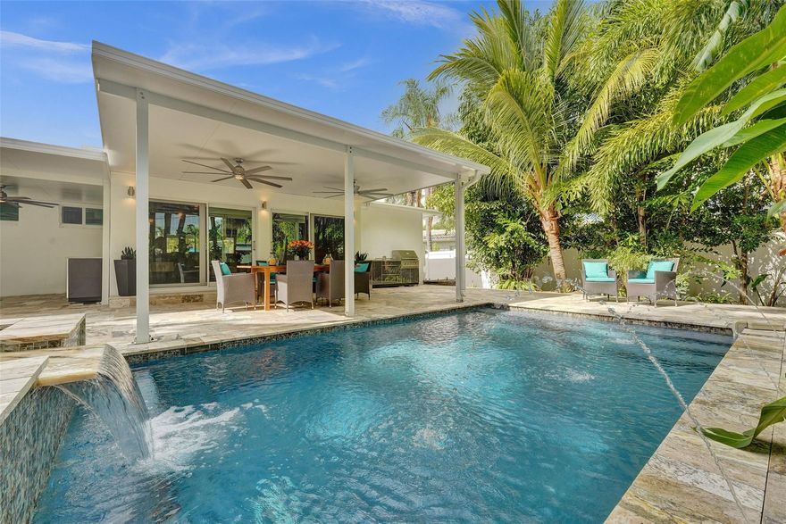 Stylishly remodeled 3-bedroom, 2-bath residence located in sought-after East Wilton Manors, offering 1,537 total square feet on a 7,834-square-foot lot. This home features classic terrazzo floors, a bright open-concept floor plan, and beautiful modern finishes throughout. The one-car garage includes an electric vehicle charging port, while hurricane impact windows and a whole-home generator with buried propane tank provide comfort and peace of mind.The resort-inspired backyard is a private oasis with lush landscaping, a saltwater pool and hot tub, two covered seating areas, and a dedicated outdoor barbecue area, perfect for entertaining or unwinding. Ideally located close to the beach, downtown Fort Lauderdale, and Wilton Drive, with easy access to dining, shopping, and nightlife.