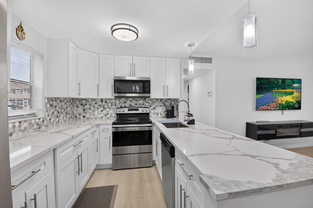 Photo of 352 Brittany H, Delray Beach, FL 33446 (MLS # B26069058)