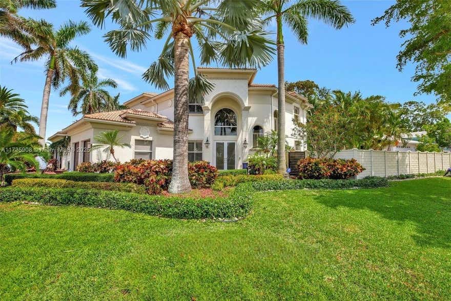 Discover your dream home in this beautifully updated 4-bedroom, 3.5-bathroom oasis with an open loft, 2-car garage, and private pool in the desirable Marina Area of Lighthouse Point. Built in 2003, this residence features high ceilings, hurricane-impact windows/doors, and a spacious floor plan. The main level welcomes a foyer, an open kitchen with stainless steel appliances, granite countertops, a breakfast bar, a separate dining room, a living/family room, a half bath, and a full guest suite. The primary suite includes a large walk-in closet, dual vanities, a walk-in shower, a whirlpool tub, and a separate vanity/dressing area. Relax in your fully fenced yard with a covered patio, private pool, and lush green space. Just blocks from Nauti Dawg, Cap's Place, and the marina. Schedule today! huge closets,corner property, great yard, 2 blocks from marina