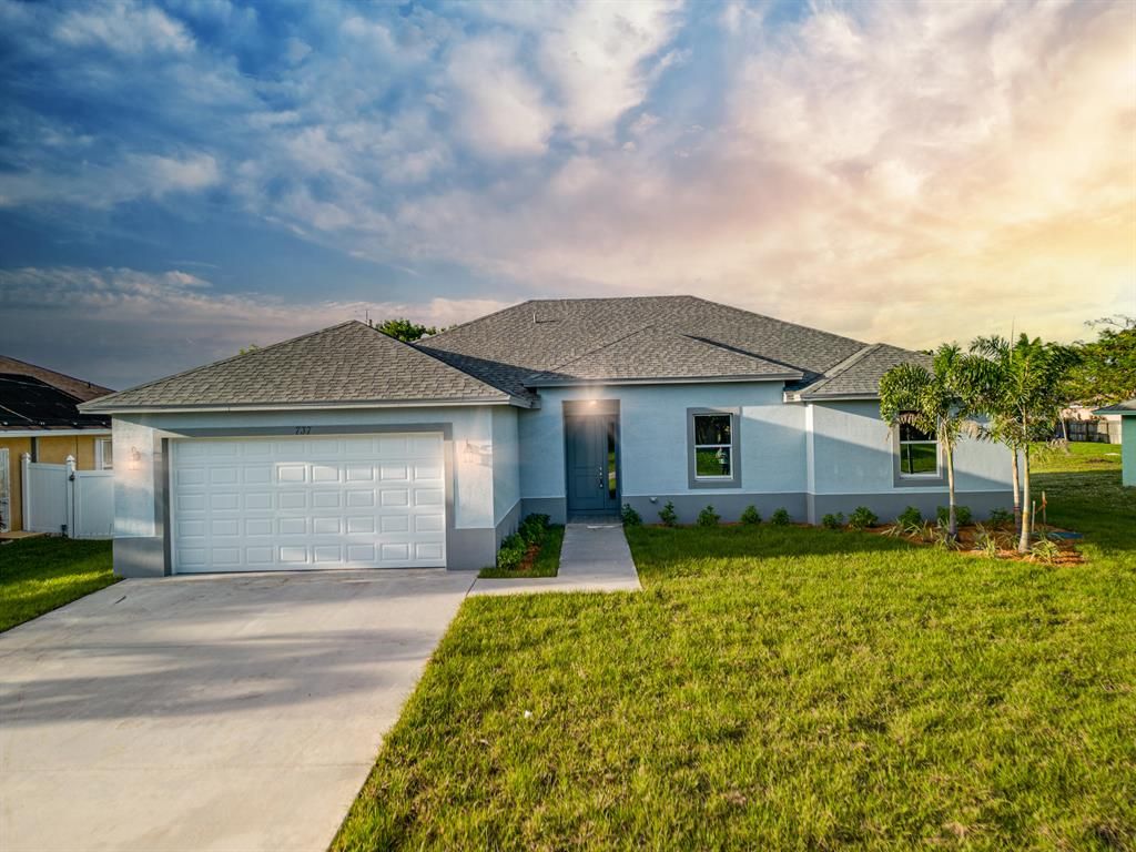 Photo of 1661 SW Crawford Avenue, Port St Lucie, FL 34953 (MLS # R10877649)