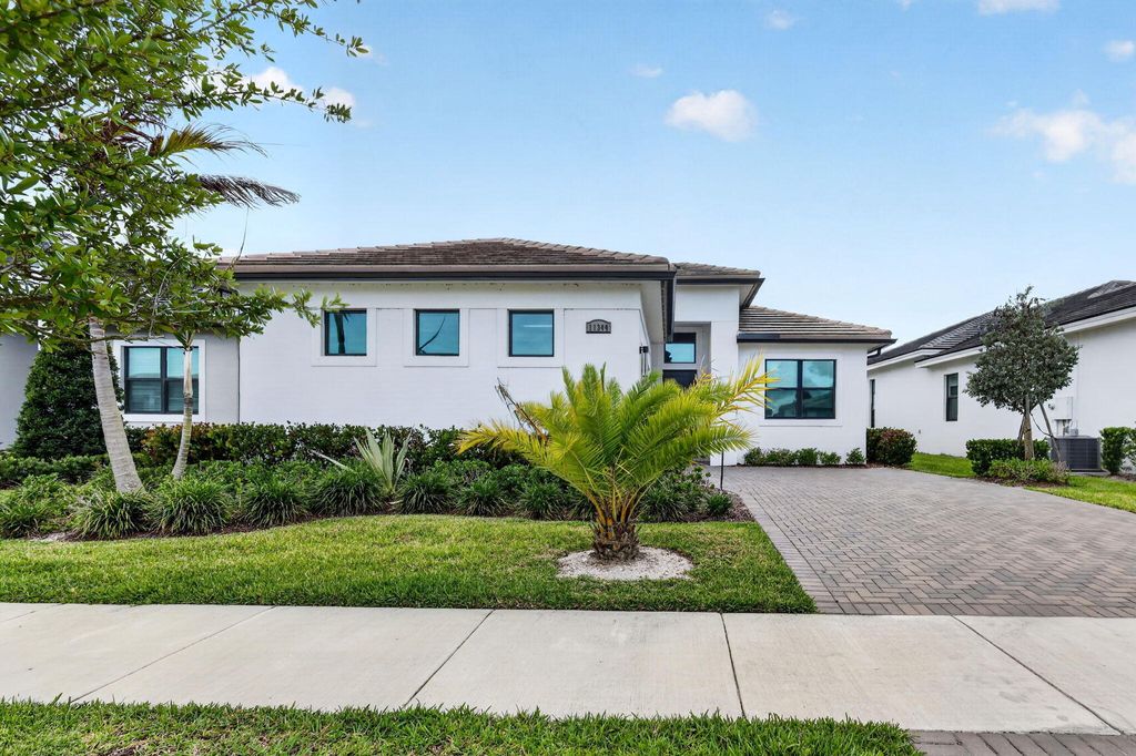 Photo of 11344 SW Pietra Way, Port Saint Lucie, FL 34987 (MLS # B26032358)