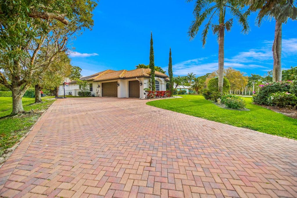 Photo of 10351 SW Whooping Crane Way, Palm City, FL 34990 (MLS # R10935005)