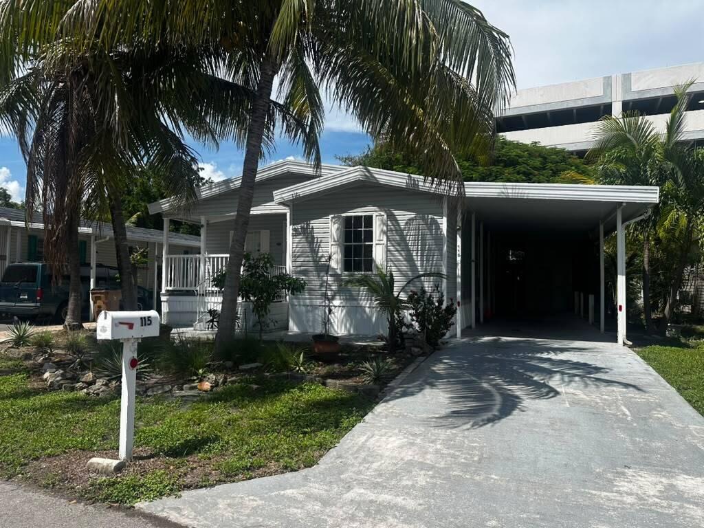 Photo of 115 NE 52nd Street, Pompano Beach, FL 33064 (MLS # B26078208)