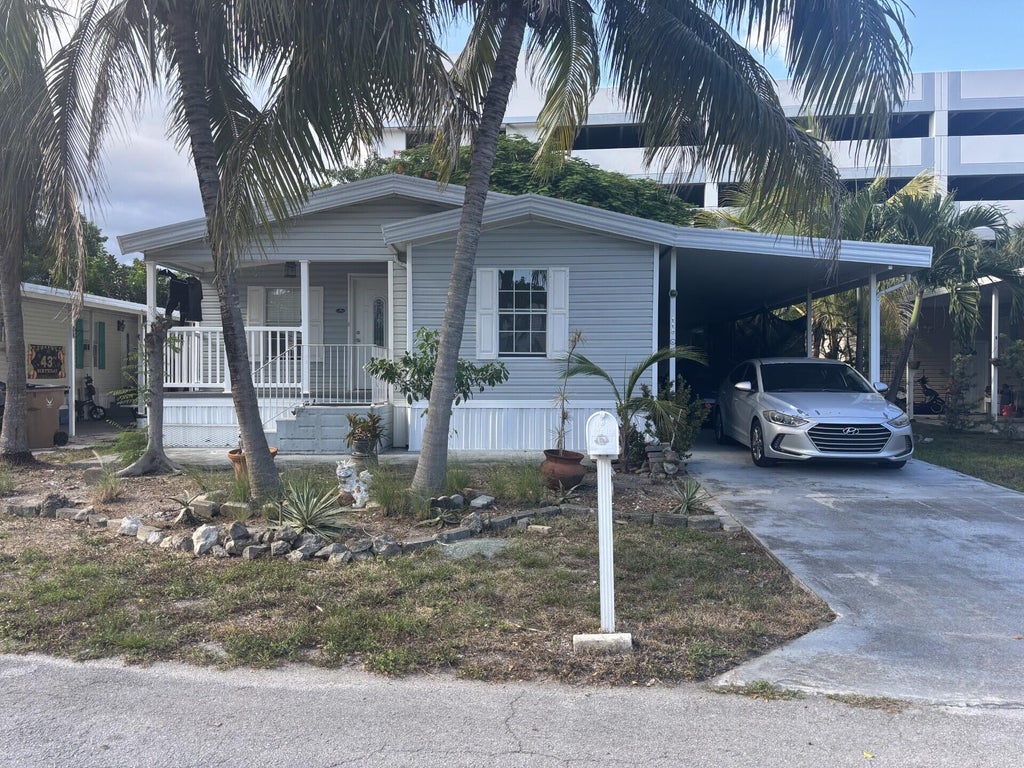 Photo of 115 NE 52nd Street, Pompano Beach, FL 33064 (MLS # B26078208)