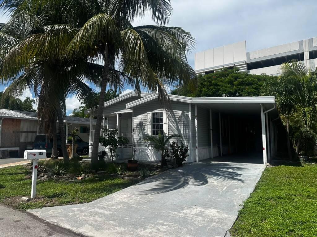 Photo of 115 NE 52nd Street, Pompano Beach, FL 33064 (MLS # B26078208)
