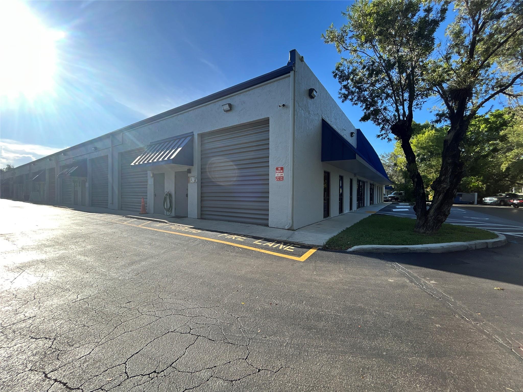 ***VERSATILE SUNRISE INDUSTRIAL CONDO*** – 1,096 SF CORNER UNIT! PERFECTLY LOCATED NEAR TAMARAC & PLANTATION, THIS HIGH-CLEARANCE SPACE BOASTS 16'5" CEILINGS, A 12' ROLL-UP DOOR, AND UPSTAIRS STORAGE. INCLUDES A SEPARATE STOREFRONT/OFFICE AND PRIVATE RESTROOM, IDEAL FOR CLIENT-FACING BUSINESSES. TWO ASSIGNED SPACES PLUS OPEN PARKING. LANDLORD COVERS TRASH, WATER, SEWER, AND HOA—TENANT PAYS ELECTRICITY. EXCELLENT FOR TRADES, LIGHT MANUFACTURING, OR STORAGE WITH CONVENIENT TRUCK ACCESS.