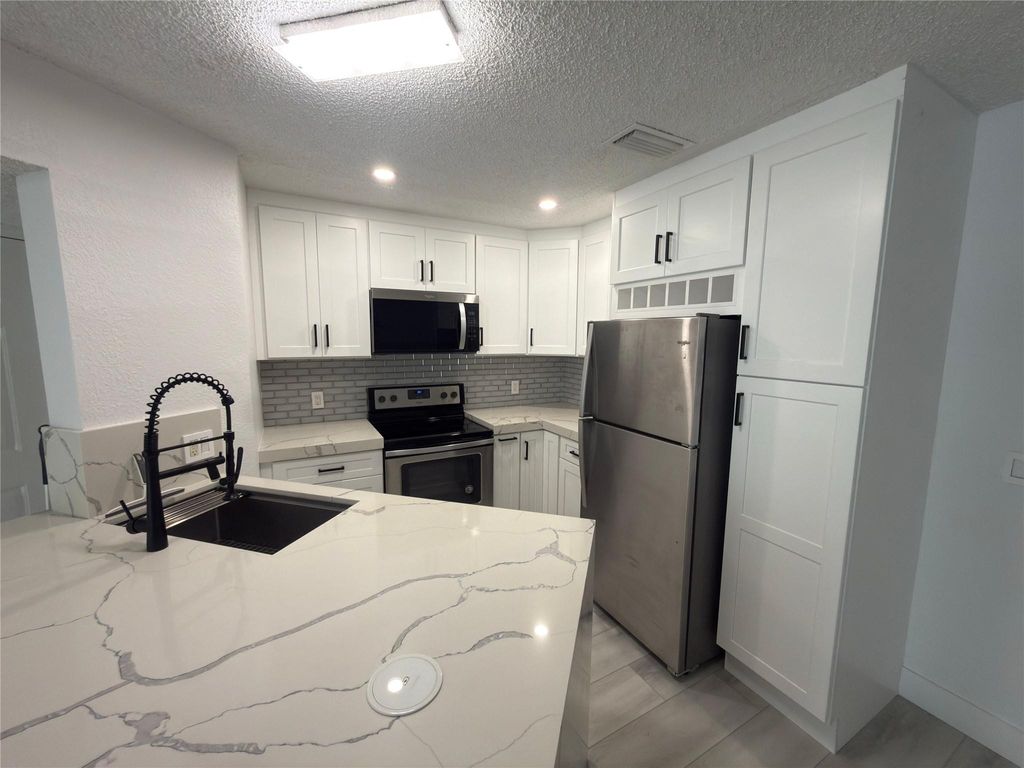 Photo of 3470 Pinewalk Drive #214, Margate, FL 33063 (MLS # F10549666)