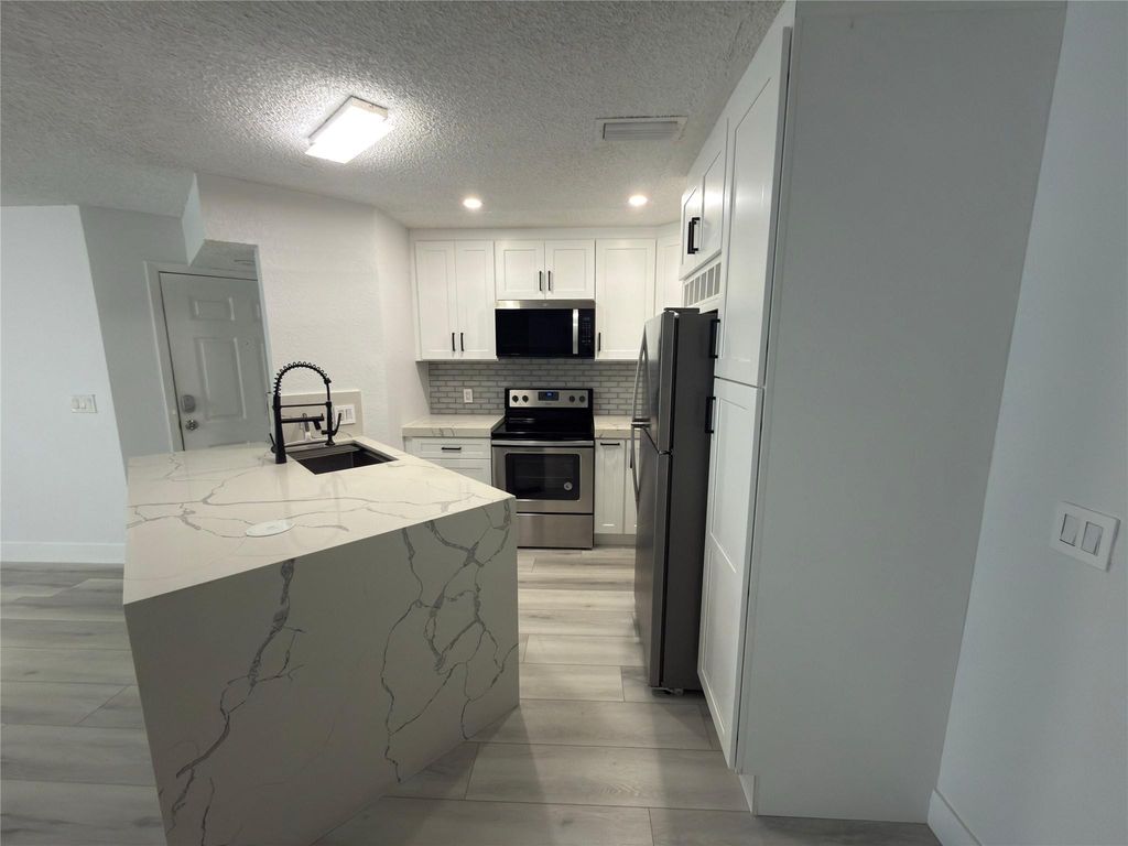 Photo of 3470 Pinewalk Drive #214, Margate, FL 33063 (MLS # F10549666)