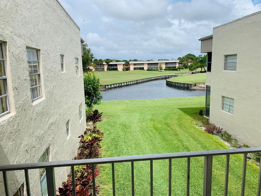 Enjoy serene mornings and relaxing evenings in this 1 bedroom, 1 bathroom condo featuring stunning views of the golf course (throughout the family room) and peaceful canal. Perfectly located near the community entrance, this unit offers easy access while maintaining a sense of privacy and tranquility.Step inside to find a bright and open living space, semi-furnished for your convenience. The screened-in porch is a standout feature, ideal for enjoying Florida's beautiful weather and also housing a private washer and dryer -- a rare and practical perk.