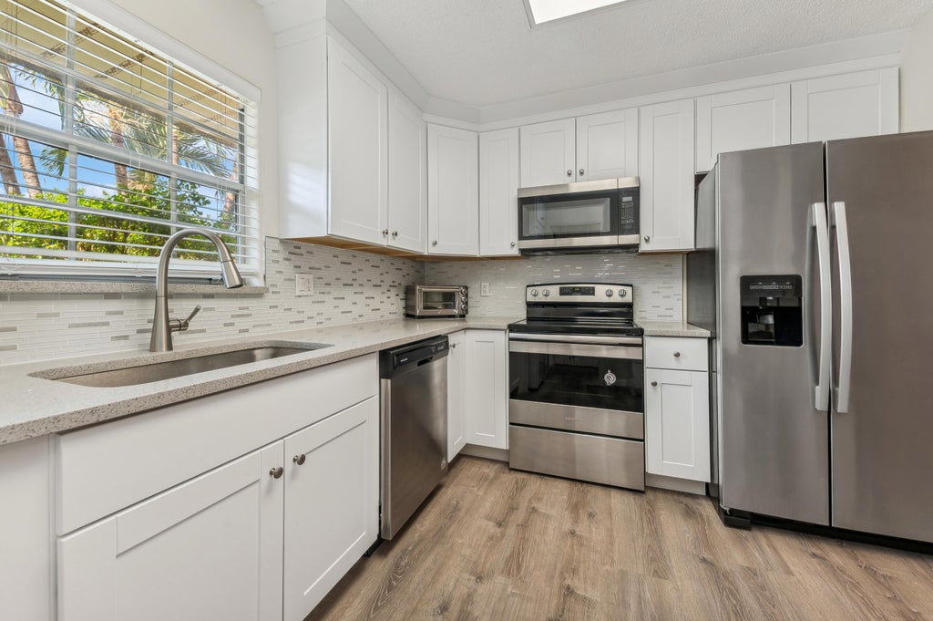 Photo of 118 Amherst Lane, Lake Worth, FL 33467 (MLS # B26076197)
