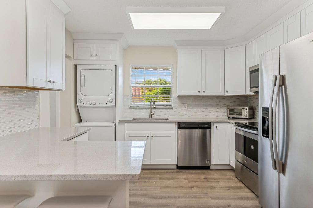Photo of 118 Amherst Lane, Lake Worth, FL 33467 (MLS # B26076197)