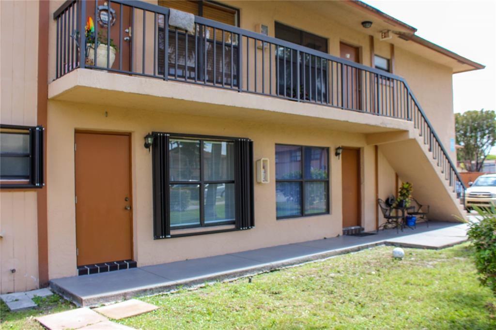 Spacious 2/2 Corner Unit in Prime Location! This well-maintained first-floor condo in the gated Lago Grande community features tiled flooring throughout, hurricane shutters, and an in-unit washer and dryer for added convenience. The bright corner layout offers great natural light and an easy move-in experience. Close to shopping, dining, major highways, and more. Don’t miss this great opportunity!