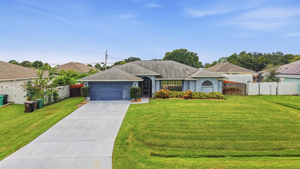 Photo of 1980 SW AGUERO Street, Port Saint Lucie, FL 34953 (MLS # B26077908)