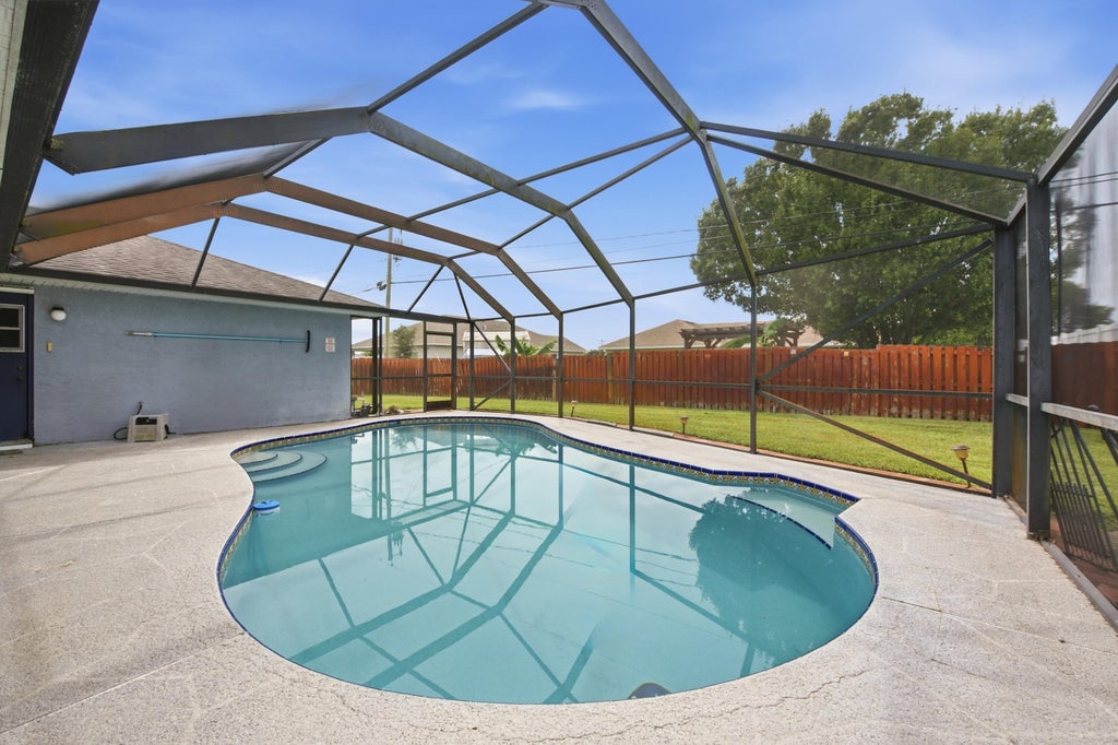 Photo of 1980 SW AGUERO Street, Port Saint Lucie, FL 34953 (MLS # B26077908)