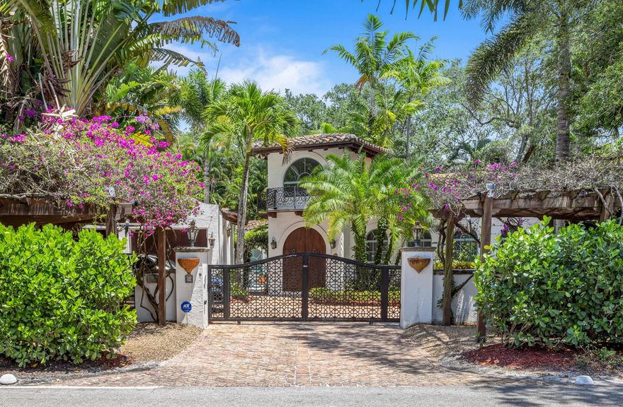 This walled and gated Compound Property includes two separate lots with a Main House (2.962 LV.sf. / 3,485 Tot.sf.) and Guest House (2,360 LV.sf. / 2,678 Tot.sf.) on over a 1/2 acre. The light-filled interior of the main residence is appointed with washed pecky cypress beamed ceilings, wide plank pecan wood flooring, custom moldings and architectural arches unify this single-story residence. A focal point is the tropical pool courtyard accessible from most major rooms. The adjacent Guest House, provides exposed vaulted ceiling, pecan wood and terra cotta tile floors, is entered from three sets of French doors along its covered terrace. The open great room and kitchen separate a large recreation/wellness room from two bedroom suites with second pool encompassed by mature landscaping
