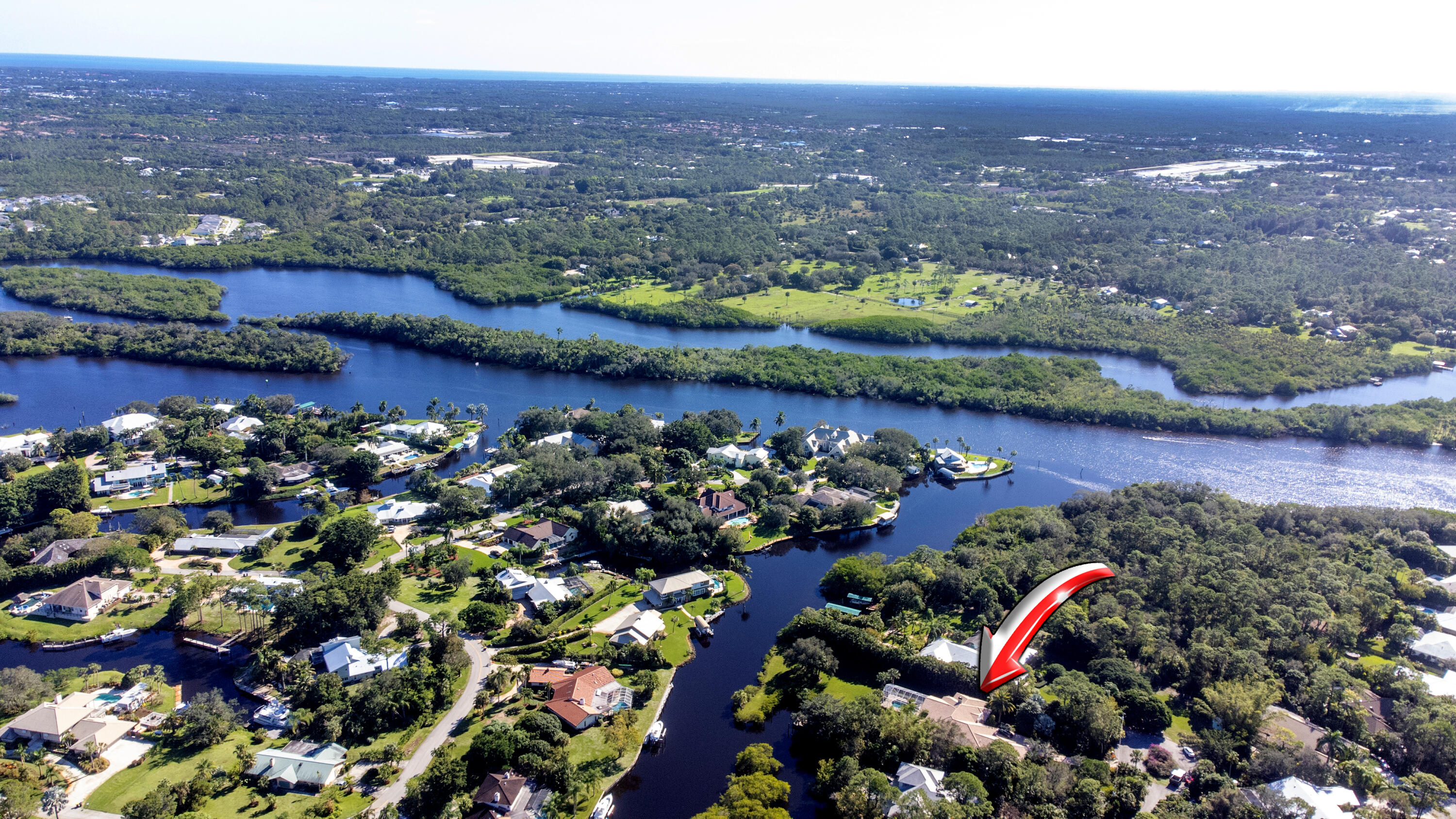 AN ENTERTAINERS DREAM HOME IN PALM CITY! Located in the highly sought after community of FOUR RIVERS with its winding canals just minutes from the wide water. Private, secluded & serene; this custom home with it's spacious open floor plan offering 4 bedrooms each with their own private ensuite, an office w/ a view, a chefs kitchen w/ a huge island & bar sitting, breakfast nook, formal living area, 10' coffered ceilings w/ accent lighting, detailed millwork galore, tile throughout w/carpet in the bedrooms, master bath offers an air bubbling messaging tub, oversize master closet w/built in shelving, & a generous laundry room. Major components-A/C unit and Hot Water Heater just replaced(2022) along with the washer and dryer. Peace of mind w/whole house generator, impact windows, concrete roof