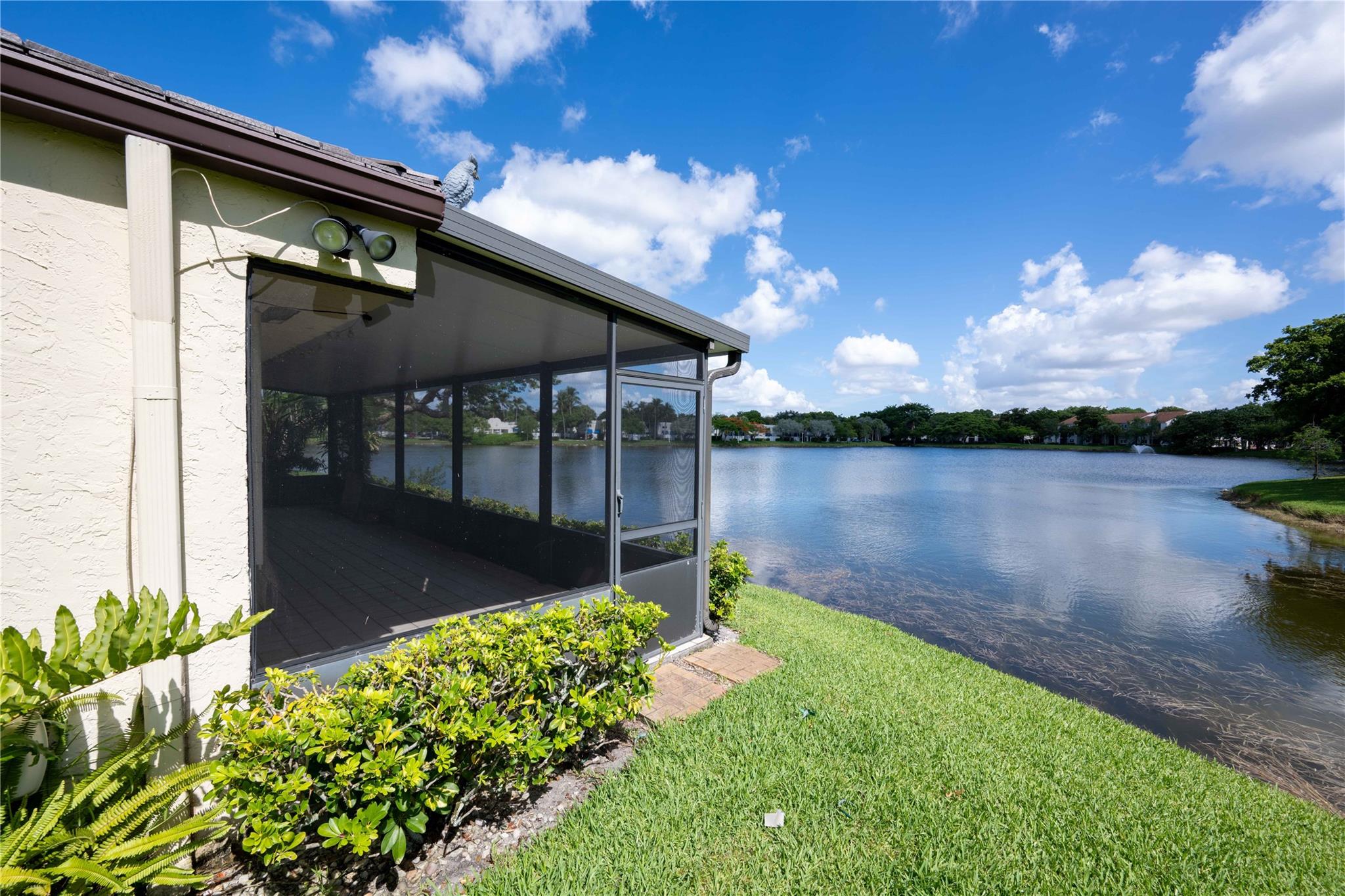 Prime Lakefront Villa in CHELSEA II, 3/2 w/garage just a short walk to Central Park. HUGE, over-sized patio overlooking the lake. Open floorplan, full storm protection (accordion shutters). Plantation Community pool. Close to everything fun. HOA fee includes lawn maintenance and roof. Buyer recently renewed the annual appliance maintenance contract that is transferable.