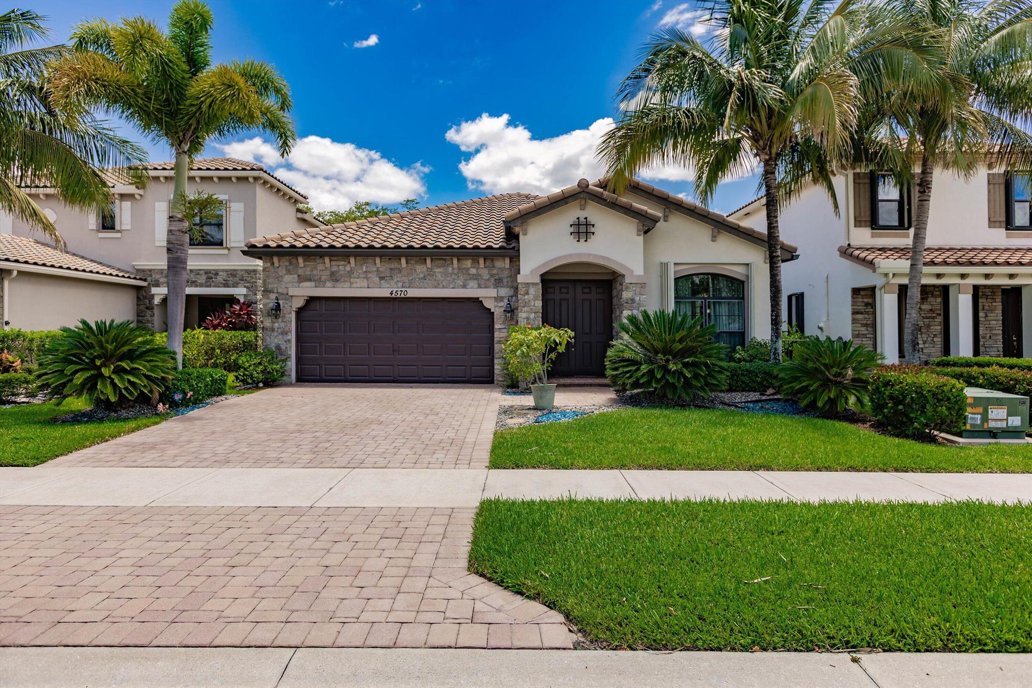 This stunning 3/2 custom contemporary home is loaded with high-end upgrades. Bright and airy with engineered hardwood throughout (no carpet) and tile in the bathrooms. The kitchen features custom wood cabinetry, quartz counters, and a tile backsplash. Bathrooms include upgraded fixtures and designer wallpaper. Custom closets, pantry, and laundry room built-ins add function. Enjoy elegant lighting, a remote Phantom screen, epoxy garage floors, and built-in garage storage. The saltwater pool (15x25) has a pebble tech finish and color-changing lights, surrounded by expanded travertine pavers. Located on one of the most private lots, backing to a forest preserve and horse farm. THIS HOUSE IS PERFECT in every way.