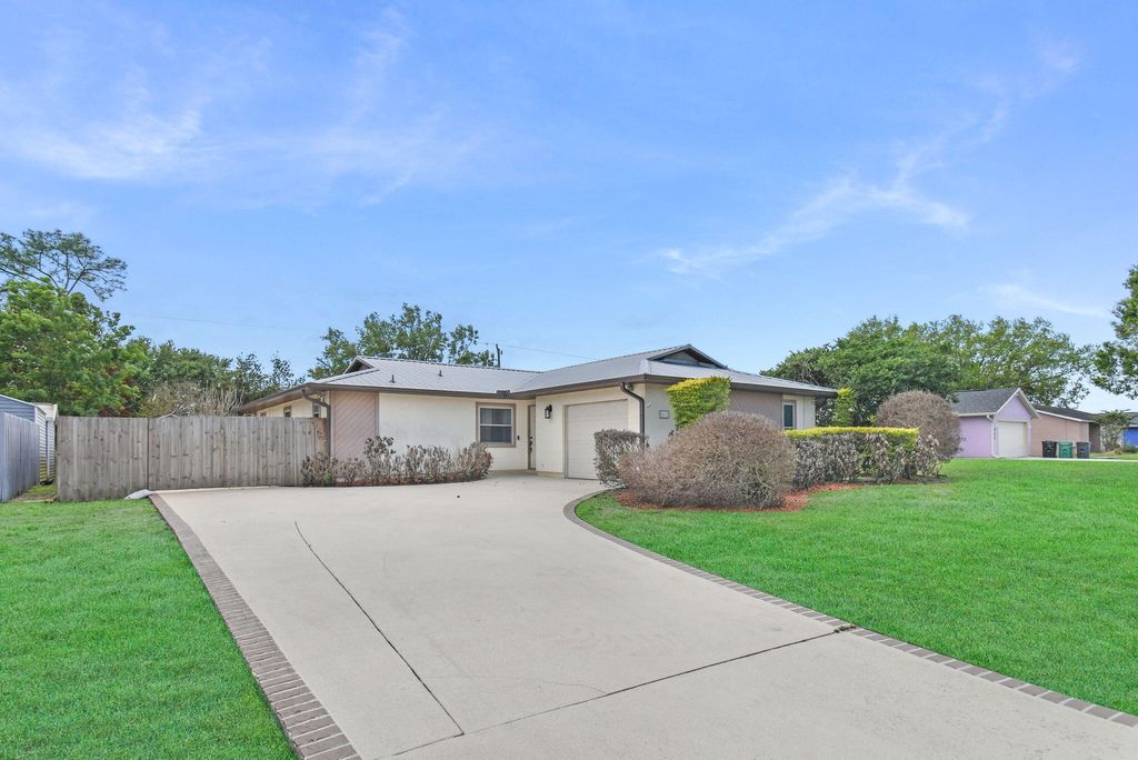 Photo of 542 NW La Brea Avenue, Port Saint Lucie, FL 34983 (MLS # B26005041)