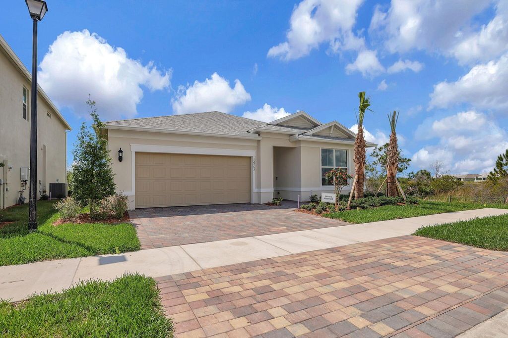 Photo of 12263 Periwinkle Court, Port Saint Lucie, FL 34987 (MLS # R10990774)