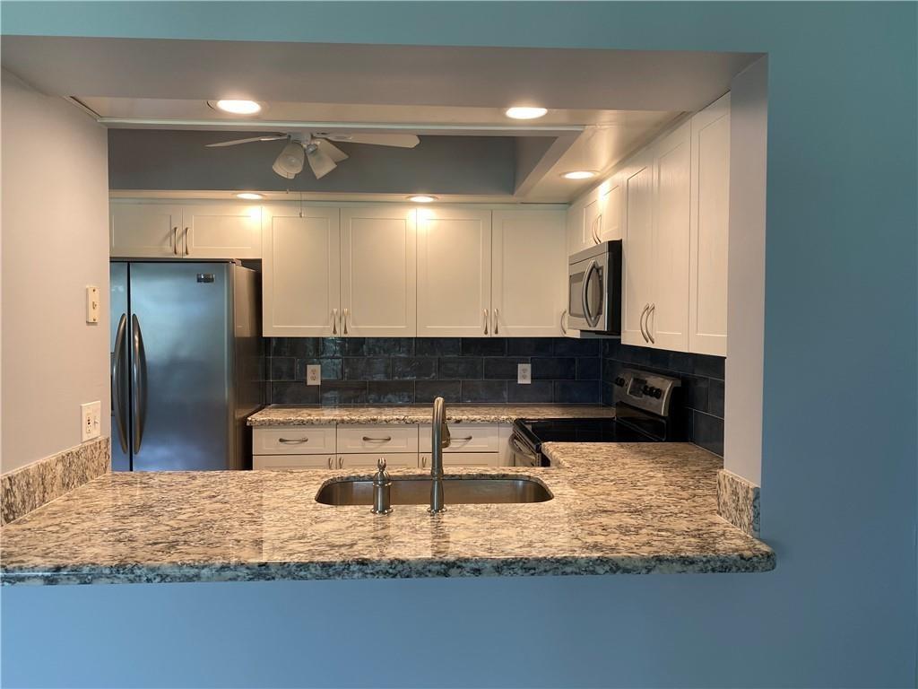 Desirable and spacious 1 bedroom and 1-1/2 bath with golf and water views, on the third floor, tiled throughout, bright with neutral colors, washer and dryer inside the unit, stainless steel appliances, screened balcony, assigned parking plus guest, elevator, excellent central location with easy access to highways, shopping, restaurants, parks, library, hospital, professional buildings and much more, in an active 55+ community with first-class amenities including great clubhouse, gym, theater, pools, tennis, courtesy transportation, security patrol, guard-gated, available golf and much more.