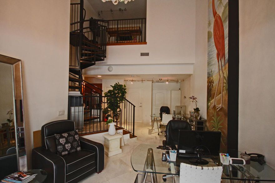 Perfectly furnished for a business! Mixed use loft with gorgeous spiral staircase, 42” kitchen cabinets, stainless steel appliance package, high ceilings, marbled master bath, assigned garage parking, private storage.
Rent in the heart of downtown West Palm Beach’s luxury corridor! Residents at One City Plaza can enjoy 24hr security, full service valet parking, steam room, sauna, fitness center, elegant club room for entertaining, lushly landscaped plaza garden with reflection fountain and heated rooftop swimming pool with panoramic views of the Ocean, Intracoastal & city. Just outside of the building you will find convenience at your fingertips…a quick walk to CityPlace or Clematis, less than 1 mile from the beach, minutes away from Palm Beach Island and a 10 minute drive to PBI airpor