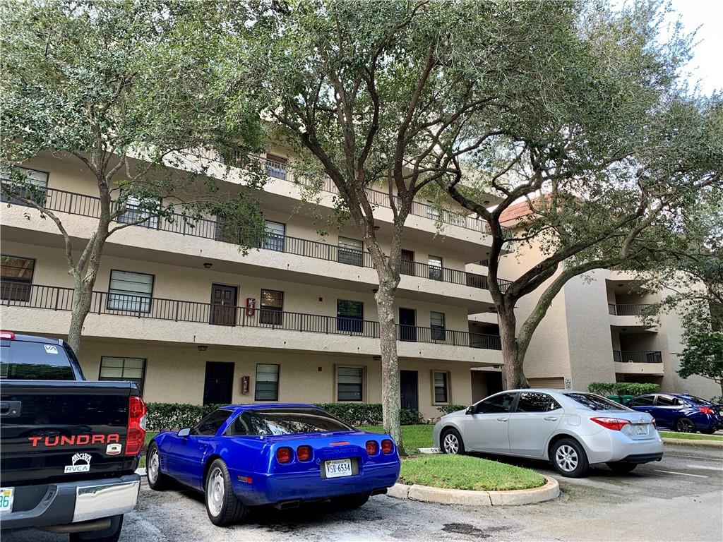 Absolutely beautiful condo in the heart of Plantation! Fourth floor gives you a wonderful view of the community. Elevator for the building. Recently remodeled kitchen is a cook's delight complete with quartz countertops, an under sink setting and beautiful cabinetry. Time to make culinary memories! Pass through into the spacious dining room and living room areas. Large master bedroom with walk in closet. Relaxing master bath with tub/shower combo and a newer vanity. Nice sized second bedroom and a second full bathroom with updated features as well. Private screened balcony with a storage room at one end. This unit has a full sized stackable washer and dryer. Beautiful flooring throughout. Newer AC. Water included in rent. Additional storage locker on your floor. Cat or small dog considered