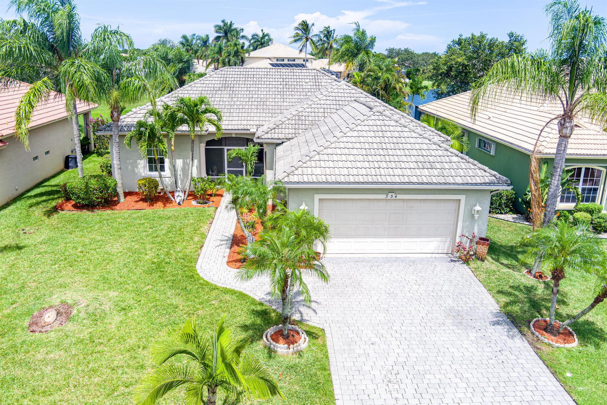 Beautiful 2BR/2BA/2CG lakefront home in the gated St. James Community! Enjoy sunrises from your screened porch overlooking a fenced yard and serene lake. Inside, an open layout features a custom floor-to-ceiling faux brick wall with a 70'' TV and stunning digital fireplace--both stay! Light-filled kitchen, spacious bedrooms, and low HOA that includes lawn care, cable, and access to pool, tennis, gym, and more. A rare find with character, comfort, and community! Living here means you're 20 minutes from pristine beaches, 10 minutes from St. Lucie West shopping and dining, and just around the corner from major commuter routes. Whether you're seeking your Florida retreat, a full-time residence, or a low-maintenance lifestyle in a gated golf community, this home is the perfect fit.