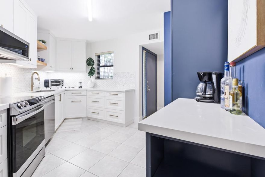 GORGEOUS 2 Bed, 2 Bath in Central Boca Raton within an All Ages, 24/7 manned-gated comm. Features include a Custom Designed Kitchen; Quartz Countertops, Stunning Backsplash, All New Appliances, Pull-out & Soft-close drawers & tons of storage!  IMPACT WINDOWS; Stacking multi-slide doors that bring an abundance of natural light to every room. Enjoy peaceful garden views on the expansive screened patio.  Short walk from your front door to your Private CARPORT! ORIGINAL OWNERS have kept this property Immaculate! Comm; resort-style amenities incl. tennis/pickleball, saunas &  4 comm. pools. Maint. fees incl. Internet, Cable, Bldg Ins, Landscaping, Water & manned-gated.  A-rated schools: Verde, Boca Middle & HS. Close to restaurants, shopping, mall, beaches, 95 & FL Tpke.  NO leasing 3 yrs
