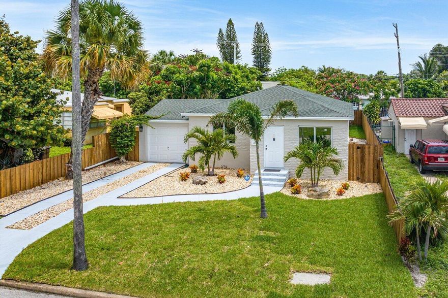 Discover this exquisite 2-bedroom, 2-bathroom Northwood home that has undergone a stunning renovation! Ideally situated just steps away from the Intracoastal waterway, this property is a true gem. Step outside onto the rear deck in  and enjoy the spacious and private backyard, perfect for relaxation and entertainment. The property also offers the potential to add a pool. With brand new impact windows and doors, this home not only guarantees security but also promotes energy efficiency. The convenient one-car garage includes built-in overhead storage, providing ample room for belongings. Public sewer and water connections ensure hassle-free living.