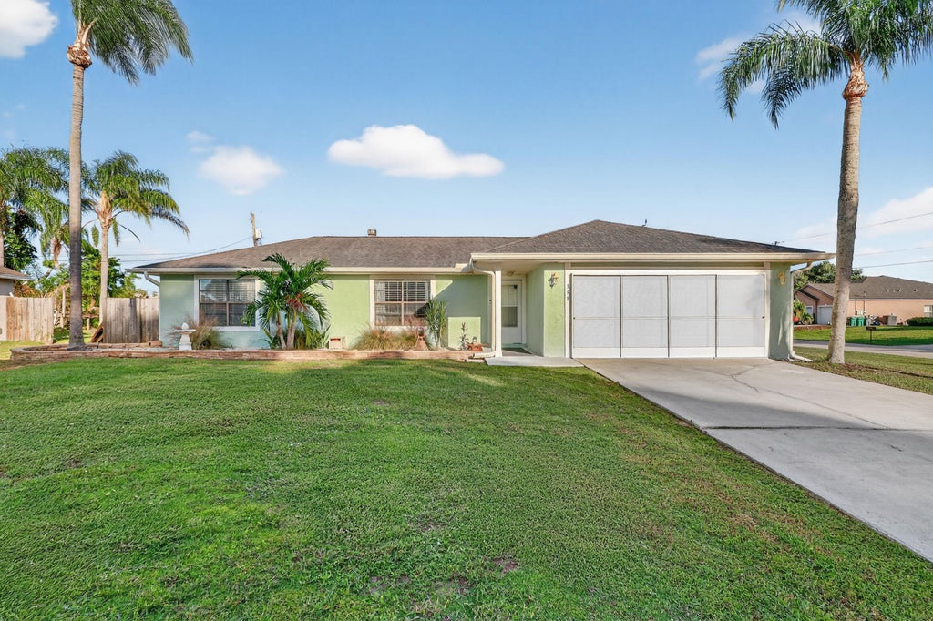 Photo of 398 SW Covington Road, Port Saint Lucie, FL 34953 (MLS # R11136792)