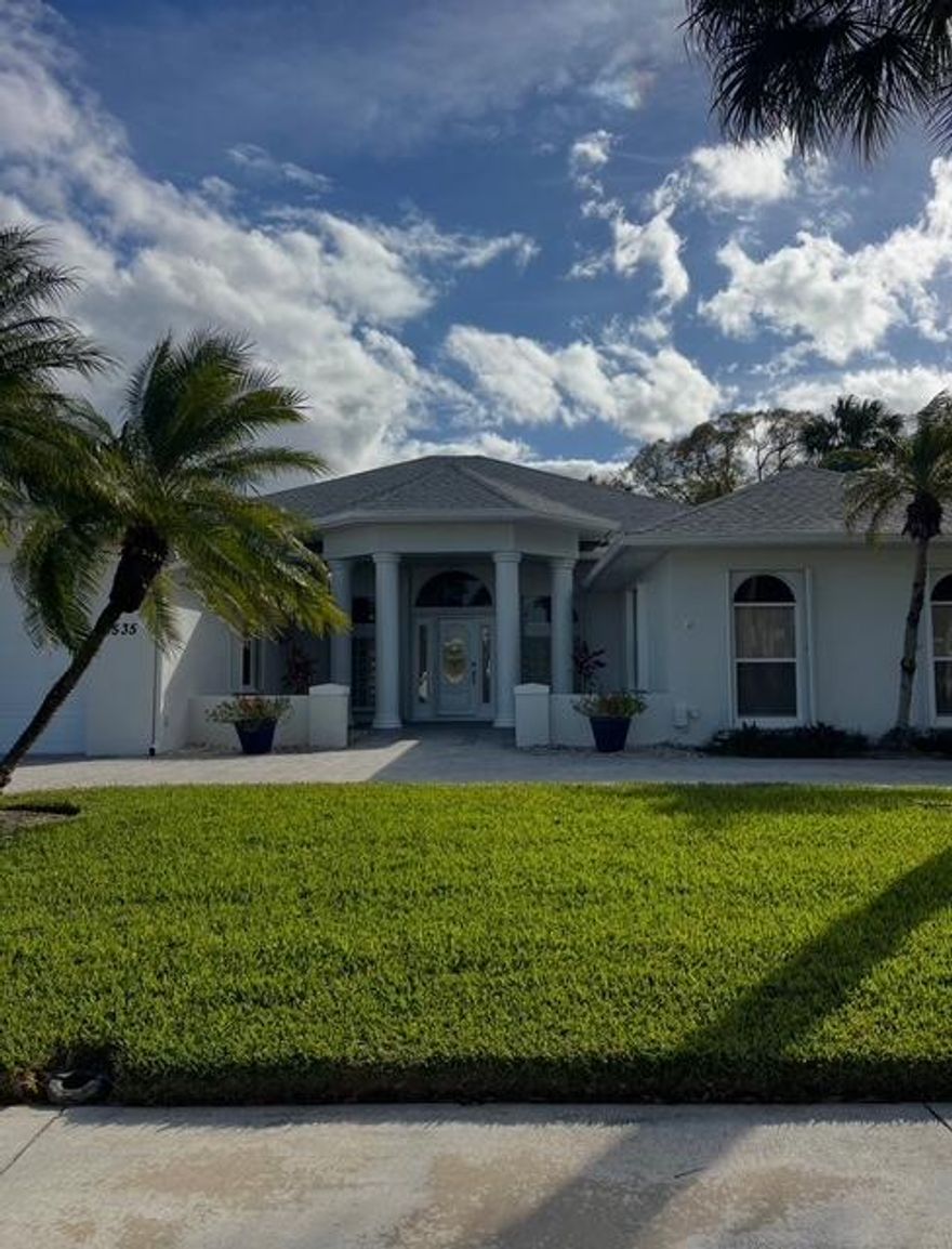 Spacious and bright 3-bedroom plus den, 2.5-bath hurricane-ready home perfect for entertaining. Features include vaulted ceilings, crown molding, a laundry room and a flexible den ideal for an office or guest space. Enjoy a large screened-in patio with serene pond views. Recent 2022 roof, hurricane shutters and impact garage doors and windows adds peace of mind. Curb appeal shines with a paver circular driveway and new exterior paint. A beautifully maintained home offering comfort, style, and functionality in the gated community of Oak Chase. Buyer to Verify Room sizes.