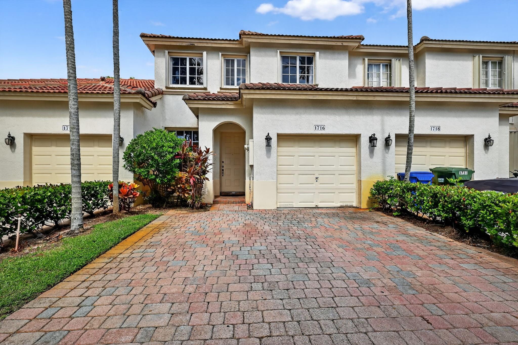 Tucked in a beautifully maintained gated community w/ community pool, children's pool, clubhouse, gym, playground & tennis, this 3-bedroom, 3 full bath townhouse PLUS LOFT is the definition of turnkey. One full bedroom & bathroom on first floor. Loft has cabinets/desk that can be a mini office space or study area. Watch TV, work, use as a play area - several possibilities. Home is located on a pond w/ privacy hedges across the way. Cul de sac street. No carpet to vaccuum. Tile & laminate throughout. Smart stainless steel appliances. Extra cabinets in kitchen wall nook. Closet racks throughout. Hurricane shutters. Approx ages: water heater 2 yrs, washer dryer 5yrs, appliances 3 yrs. HOA includes: cable, alarm, internet, manned guard gate, amentities. Cherish every moment in this home.