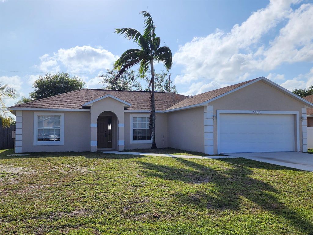 Photo of 3158 SW Esperanto Street, Port Saint Lucie, FL 34953 (MLS # R11000512)