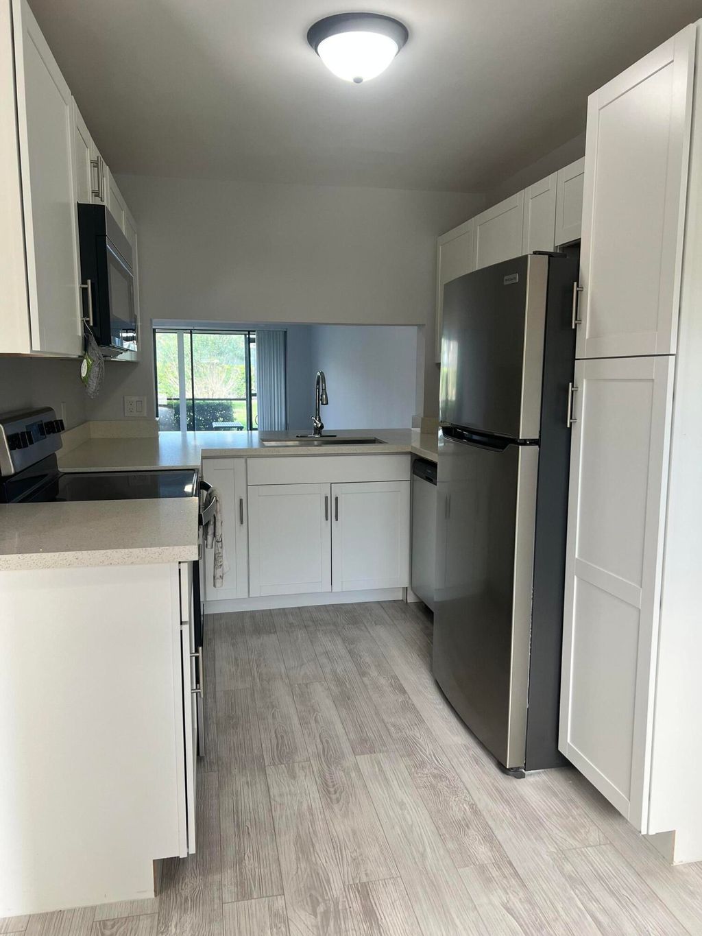 Photo of 901 Pinecrest Circle #C, Jupiter, FL 33458 (MLS # R11167630)