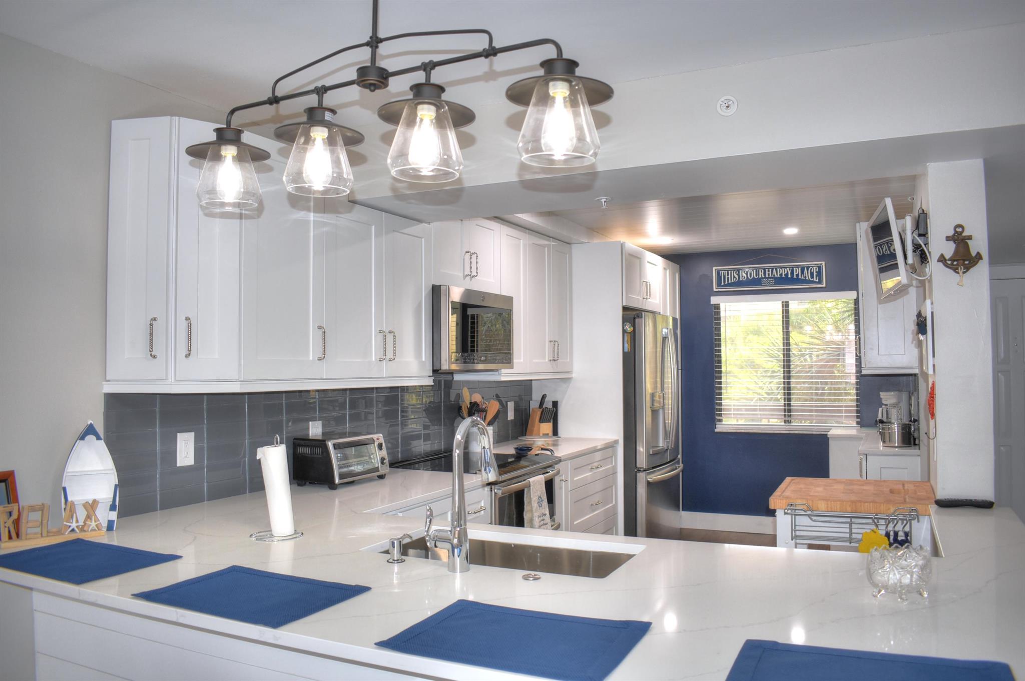 Completely remodeled ! New expanded kitchen, new baths, shaker white cabinets with quartz countertops. All new coastal furnishings. Turn Key, Furnished. They've thought of everything you will need!