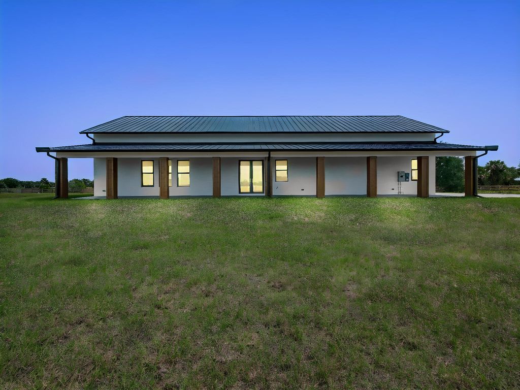 Photo of 9480 Carlton Road, Port Saint Lucie, FL 34987 (MLS # B26023122)